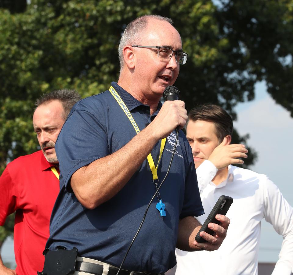 Shawn Fain, international president of the UAW, speaks from the the back of a Ford F150 at UAW headquarters near Ford’s Kentucky Truck Plant on Thursday, Aug. 24, 2023, as members gathered to hold a practice picket.