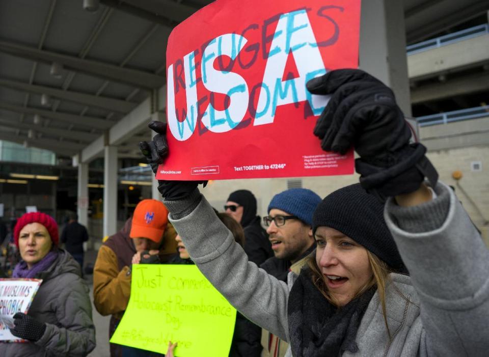 Protesters assemble at John F. Kennedy International Airport in New York, Saturday, Jan. 28, 2017 after two Iraqi refugees were detained while trying to enter the country. On Friday, Jan. 27, President Donald Trump signed an executive order suspending all immigration from countries with terrorism concerns for 90 days. Countries included in the ban are Iraq, Syria, Iran, Sudan, Libya, Somalia and Yemen, which are all Muslim-majority nations. (AP Photo/Craig Ruttle)