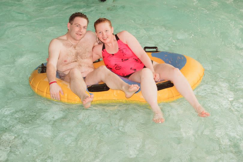Gary York with fiancee Dawn Carney, whom he proposed to whilst on the Black Hole ride at Wet N Wild indoor water park in North Shields, Tyne and Wear, England, 7th December 1997.
