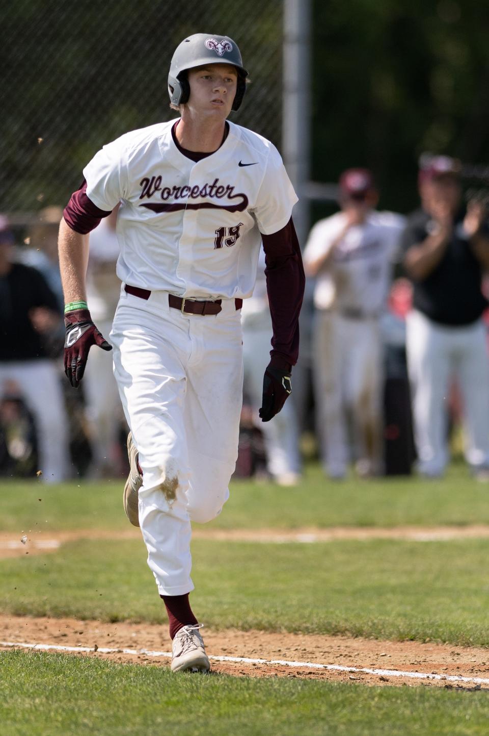 Worcester Academy's T.J. Power runs tor first versus Deerfield on Sunday May 21, 2023.