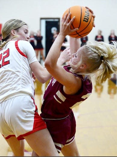 Caney Valley's Sammi Gilbreath, left, and Oklahoma Union's Haylee Lewis battle for ball possession during girls high school basketball action on Dec. 3, 2022, in Ramona.