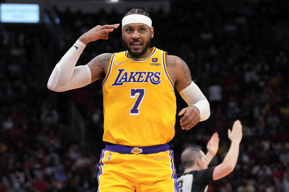 Los Angeles Lakers forward Carmelo Anthony reacts after making a 3-point basket during the first half of the team's NBA basketball game against the Houston Rockets, Tuesday, Dec. 28, 2021, in Houston. (AP Photo/Eric Christian Smith)