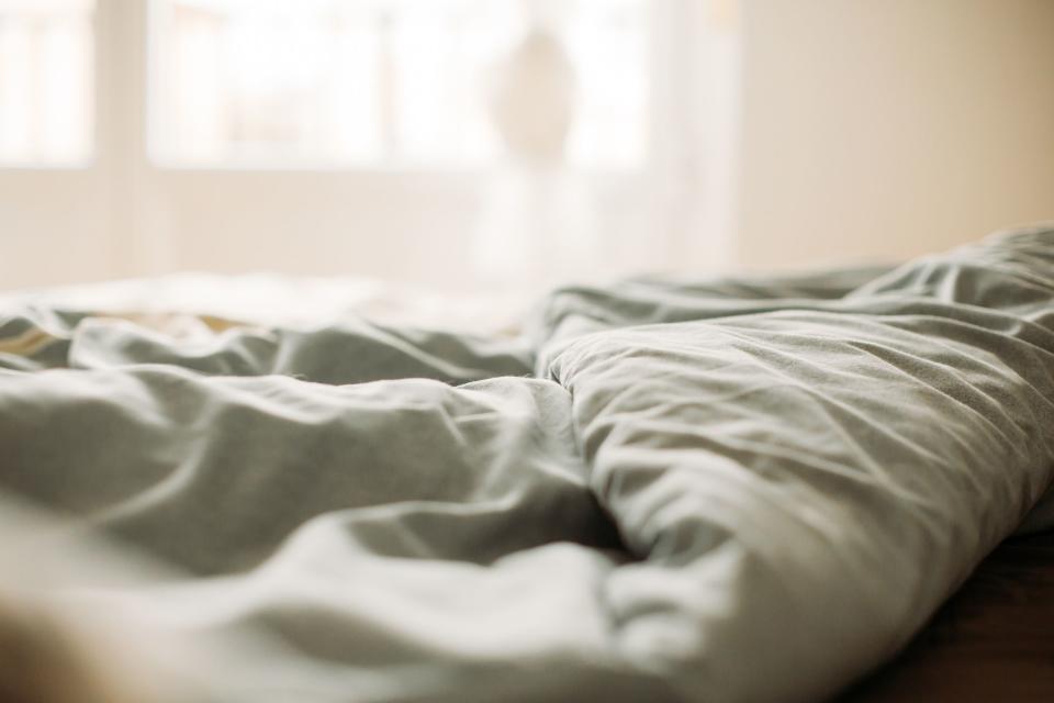 <p>Courtesy of Getty</p>
 Stock image of the corner of a grey duvet cover