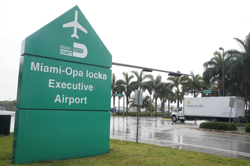 FILE - A cargo van drives near the entrance to Miami Opa-locka Executive Airport, Friday, April 29, 2022, in Opa-locka, Fla, where British Virgin Island Premier Andrew Alturo Fahie and director of ports, Oleanvine Maynard, were arrested Thursday, at the airport by undercover DEA agents. Fahie who is accused of drug-smuggling charges following a U.S. government sting in South Florida, was released Wednesday, May 4, on a $500,000 bond. In a surprise decision, federal court Judge Alicia Otazo-Reyes in Miami rejected prosecutors’ argument that Fahie would flee the U.S. if released pending trial on cocaine charges. (AP Photo/Marta Lavandier, File)