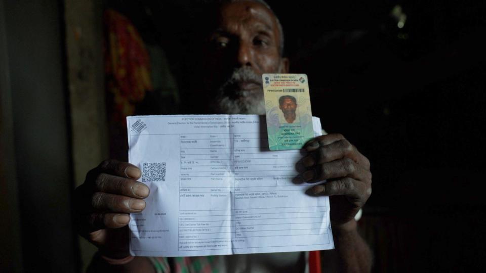 Monindra Das holds up his voter ID