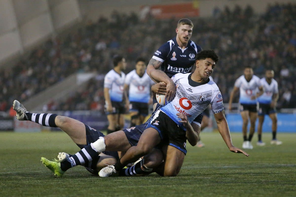 Fiji’s Josh Wong is tackled during the match against Scotland (Will Matthews/PA). (PA Wire)