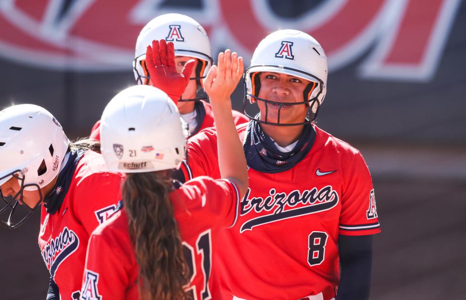 Catcher Dejah Mulipola (8) has been a star for the Wildcats behind the plate and in the batter's box.