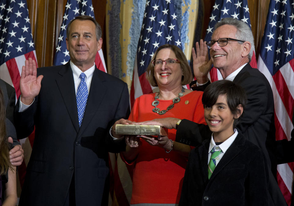 House Speaker John Boehner of Ohio performs a mock swearing in for Rep. Alan Lowenthal, D-Calif., Thursday, Jan. 3, 2013, on Capitol Hill in Washington as the 113th Congress began. (AP Photo/ Evan Vucci) 