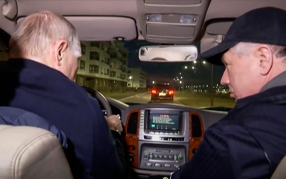 Putin was briefed by Marat Khusnullin, a deputy Russian prime minister, while he was driving - AP