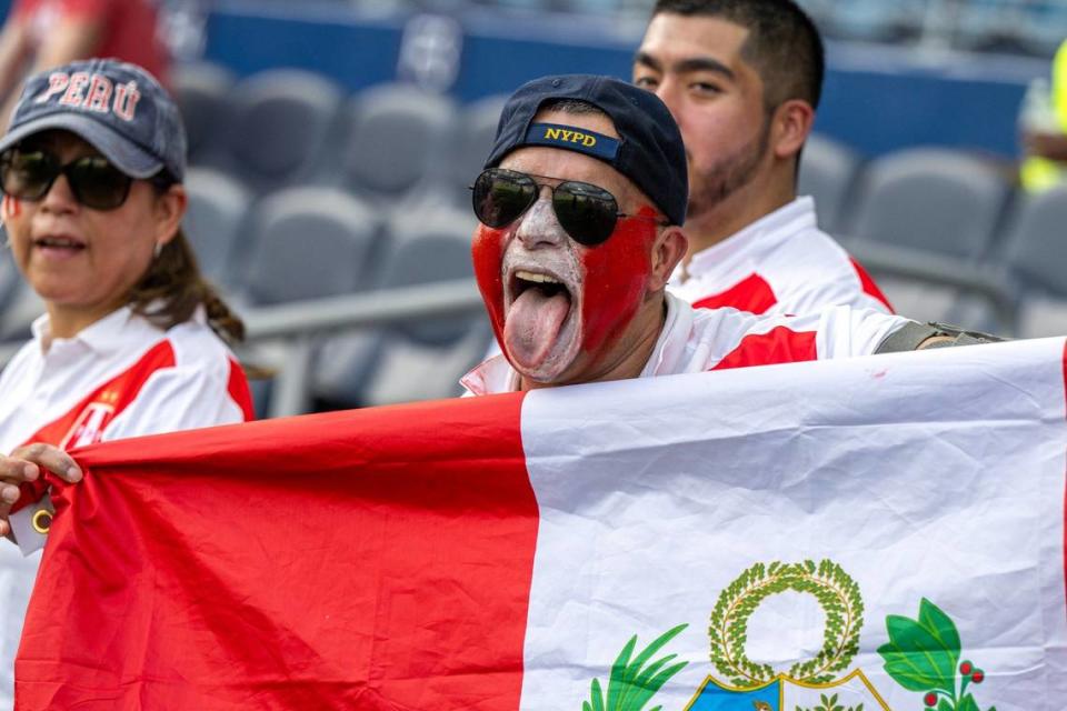 A Peru fan cheers before the start of a Group A Copa America match between Canada and Peru at Children’s Mercy Park.