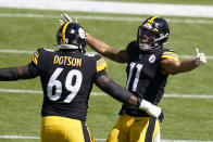 Pittsburgh Steelers wide receiver Chase Claypool (11) celebrates after scoring on an an 84-yard play with Kevin Dotson during the first half of an NFL football game against the Denver Broncos, Sunday, Sept. 20, 2020, in Pittsburgh. (AP Photo/Keith Srakocic)