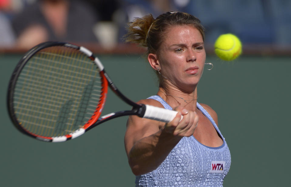 Camila Giorgi, of Italy, hits to Maria Sharapova, of Russia, during a third round match at the BNP Paribas Open tennis tournament, Monday, March 10, 2014 in Indian Wells, Calif. (AP Photo/Mark J. Terrill)