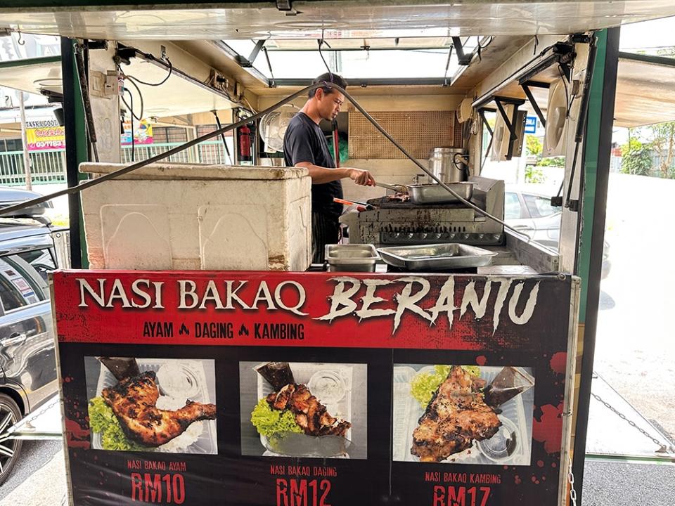 The food truck is parked in front and that is where the grilling takes place.