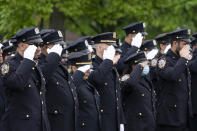 Police officers line the street as the funeral procession of New York police officer Anastasios Tsakos leaves the St. Paraskevi Greek Orthodox Shrine Church, Tuesday, May 4, 2021, in Greenlawn, N.Y. Tsakos was at the scene of an accident on the Long Island Expressway when he was struck and killed by an allegedly drunk driver a week ago. (AP Photo/Mark Lennihan)