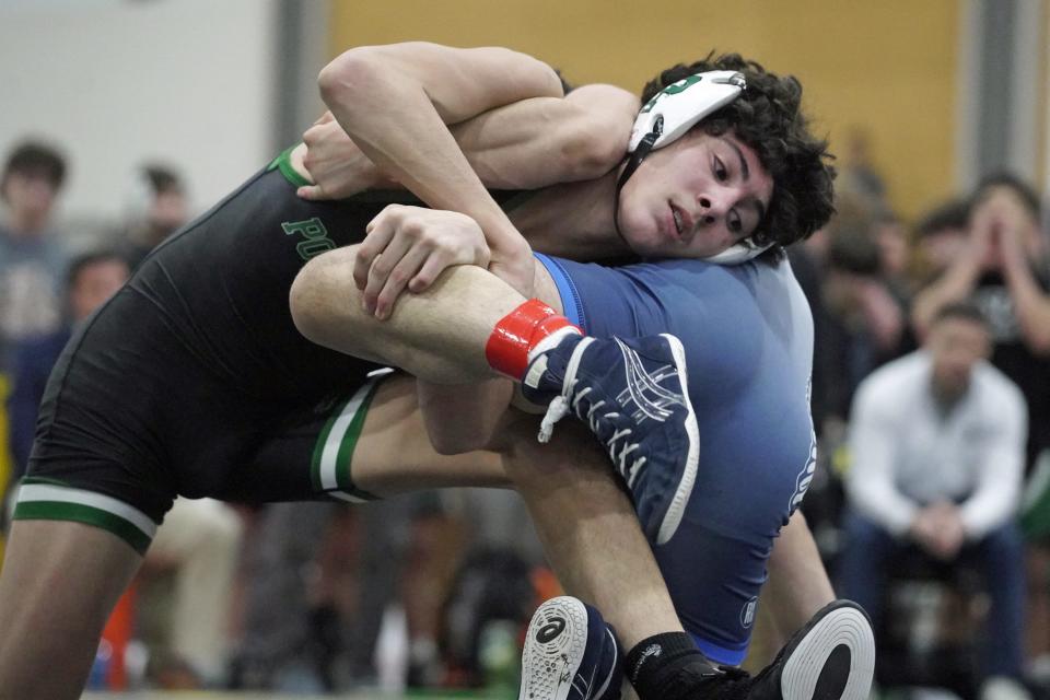On his way to a gold medal, Ponaganset freshman Apollo Bellini wrestles against Scituate's Caden Hughes.