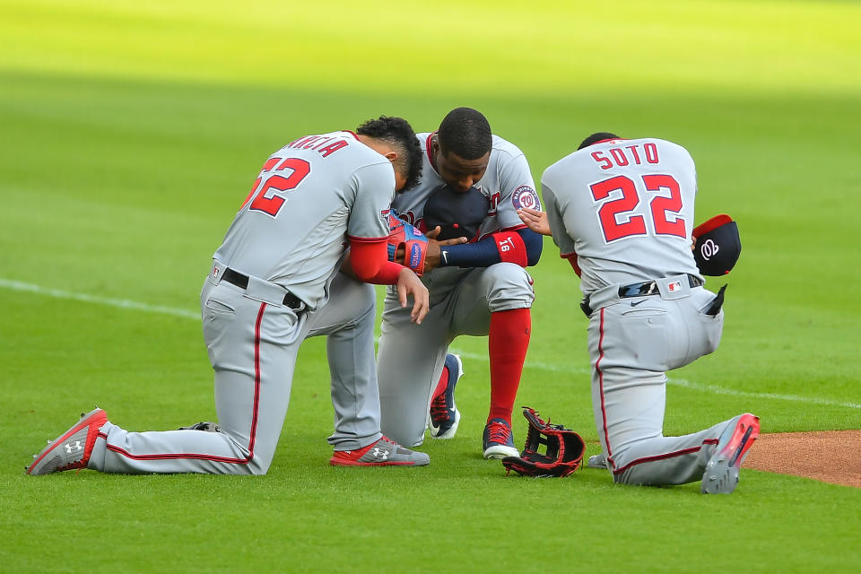 ATLANTA, GA  AUGUST 17:  Washington Nationals shortstop Luis Garcia (62), center fielder Victor Robles (16), and left fielder Juan Soto (22) say a prayer prior the start of the MLB game between the Washington Nationals and the Atlanta Braves on August 17th, 2020 at Truist Park in Atlanta, GA. (Photo by Rich von Biberstein/Icon Sportswire via Getty Images)