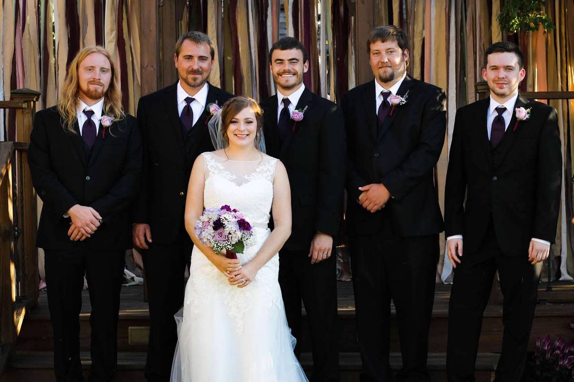 From left to right: Chas Laughlin, Beau Laughlin, Gabby (Odegard) Laughlin, Erik Odegard, Taylor Hawkins and Christopher Dennis pose for a wedding photograph on Sept. 26, 2015 in Platte City. Hawkins, 31, was shot and killed in rural Platte County on June 28. Sheriff’s deputies were searching for two persons of interest in the killing.