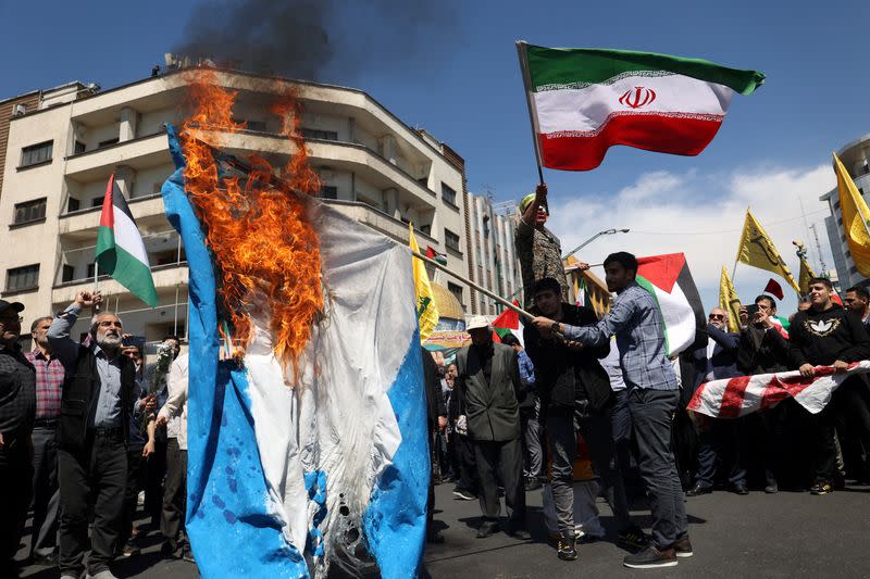 FILE PHOTO: Iranians attend a rally marking Quds Day and the funeral of members of the Islamic Revolutionary Guard Corps, in Tehran