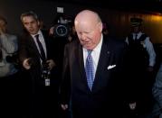 Media surround Senator Mike Duffy as he leaves Parliament Tuesday October 22, 2013. THE CANADIAN PRESS/Adrian Wyld