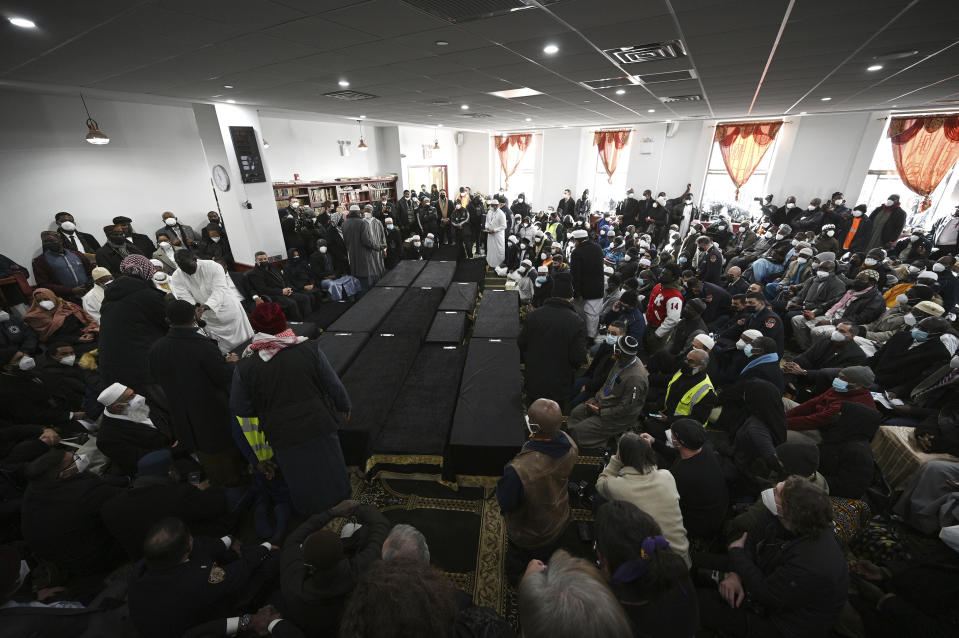 Caskets are set inside the Islamic Cultural Center of the Bronx for a mass funeral for 15 of the 17 victims of a fire in a Bronx apartment building, in the Bronx borough of New York City, January 16, 2022. The January 9th fire, believed to have been caused by a defective electrical space heater, claimed 17 lives, including 8 children in New York City’s deadliest fire in three decades. - Credit: Anthony Behar/Sipa USA/AP Images