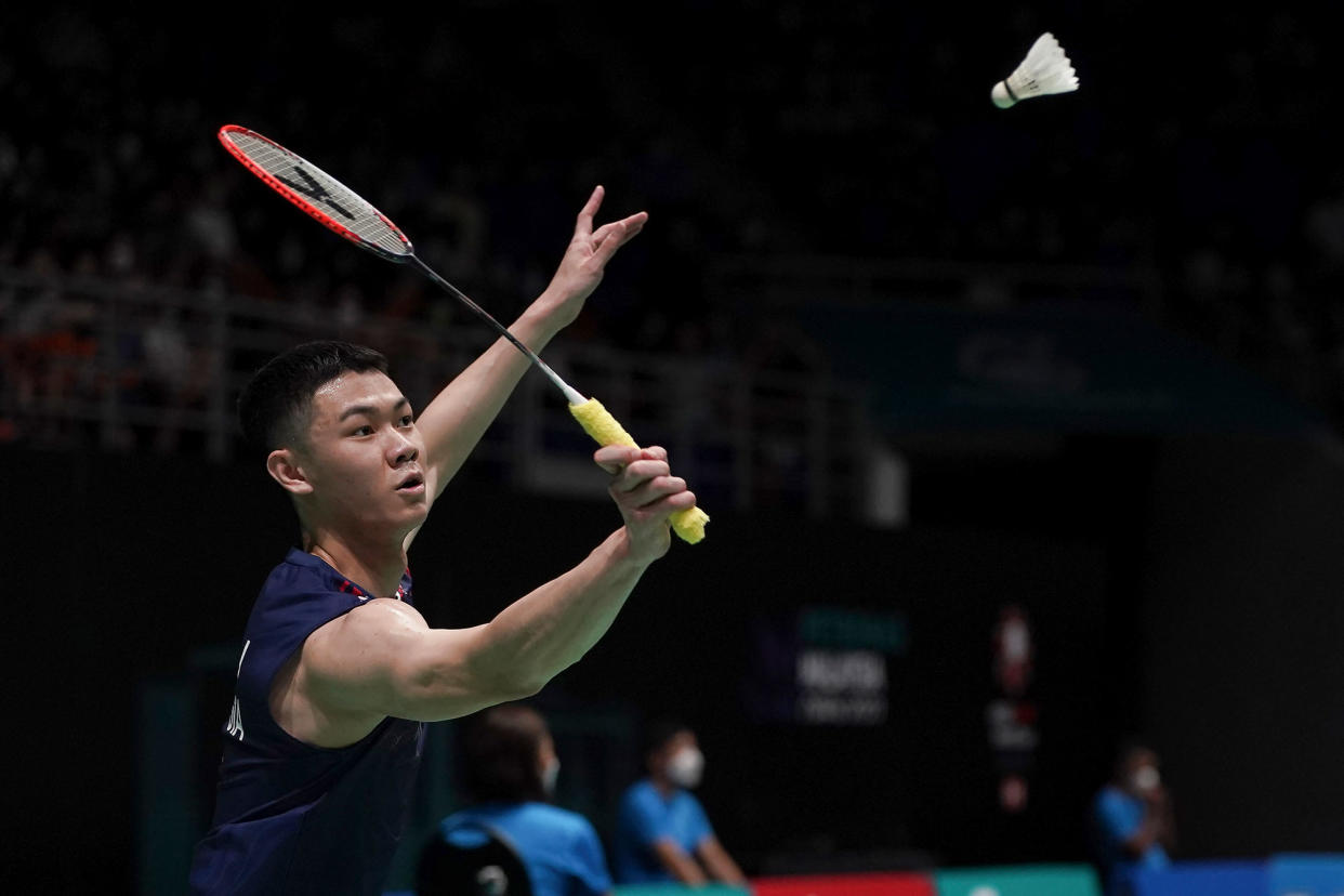 Malaysian shuttler Lee Zii Jia returning a shot (PHOTO: AP/Kien Huo)