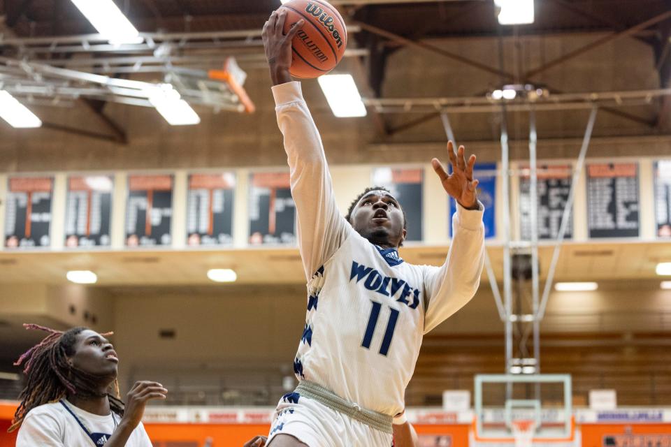 Michigan City's Jamie Hodges Jr. (11) goes up for a shot during the South Bend Adams-Michigan City high school 4A sectional basketball game on Tuesday, February 28, 2023, at LaPorte High School in LaPorte, Indiana.