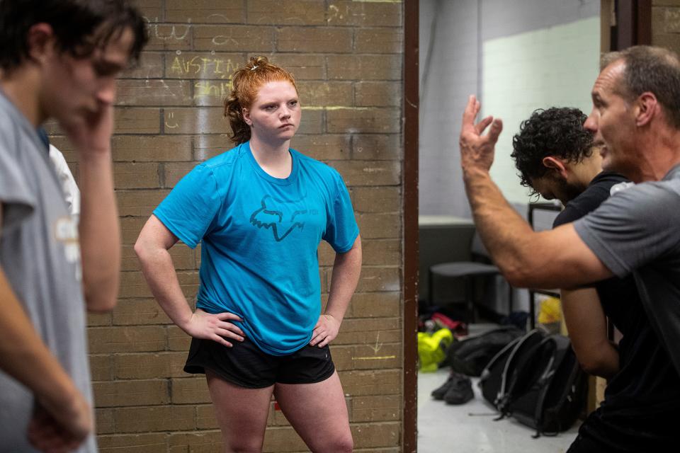 Murphy wrestler Aiden Smith listens to her coach explain a move, November 7, 2023.