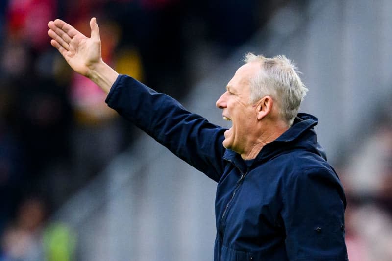 Freiburg coach Christian Streich gestures to his players from the touchline during the German Bundesliga soccer match between SC Freiburg and Eintracht Frankfurt at Europa-Park Stadium. Tom Weller/dpa