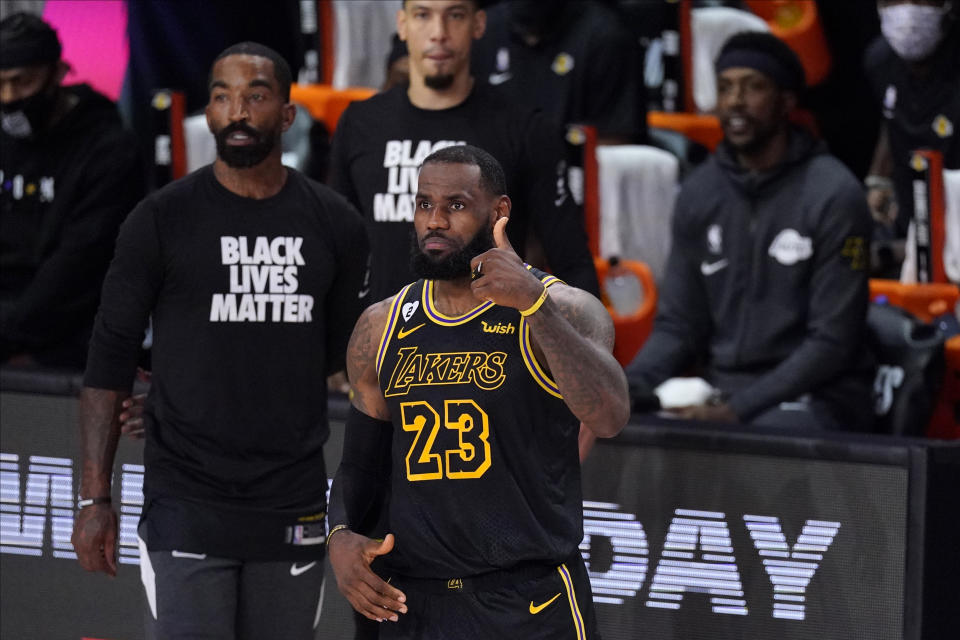 Los Angeles Lakers' LeBron James (23) gives a thumbs-up during the second half of an NBA conference semifinal playoff basketball game against the Houston Rockets Sunday, Sept. 6, 2020, in Lake Buena Vista, Fla. (AP Photo/Mark J. Terrill)