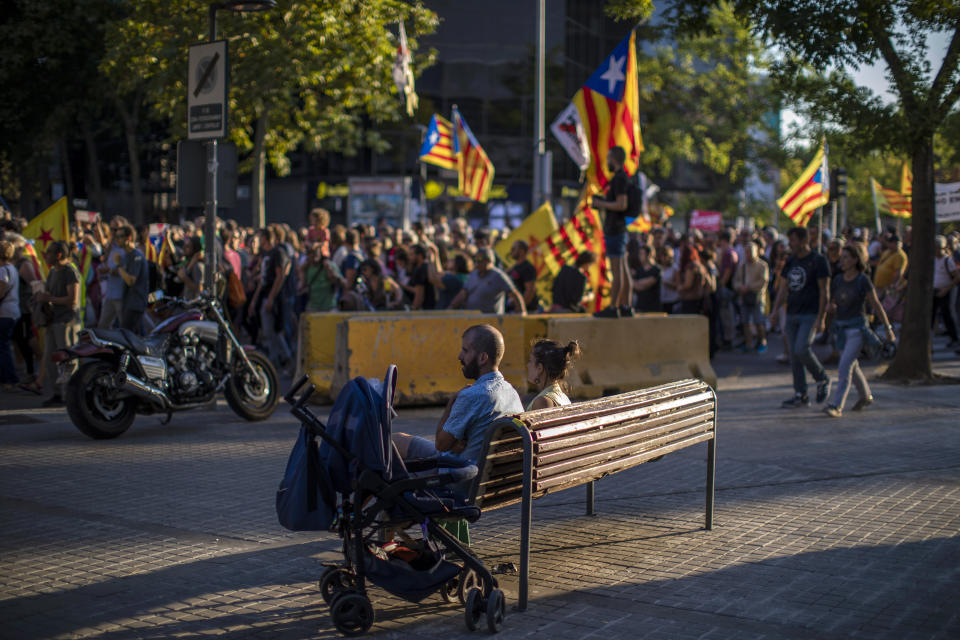 Pro-independence demonstrators march during a protest in Sabadell, near Barcelona, Spain, Saturday, Sept. 28, 2019. Several thousand people have marched in a town near Barcelona to protest the jailing of seven Catalan separatists for allegedly planning to commit violent acts of terrorism with explosives. (AP Photo/Emilio Morenatti)