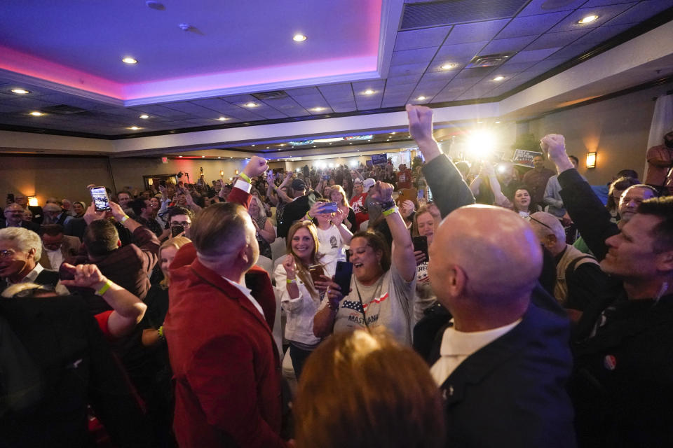 State Sen. Doug Mastriano R-Franklin, the Republican candidate for Governor of Pennsylvania, right, turns to the cheering crowd during his primary night election celebration in Chambersburg, Pa., Tuesday, May 17, 2022. (AP Photo/Carolyn Kaster)