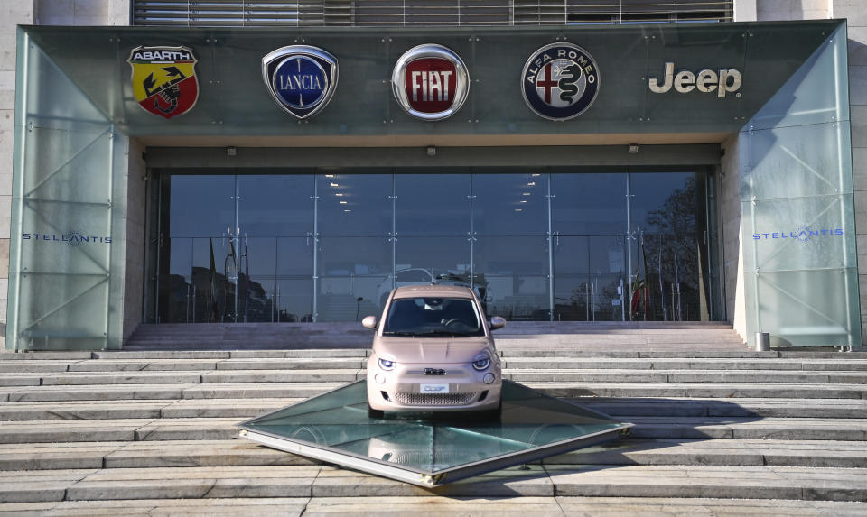 The new Stellantis logo was added on the side of the other logos of the group, on the day of the stock market debut, at the historic Mirafiori headquarters in Turin, Italy, Monday, Jan. 18, 2021. Stellantis, the car company combining PSA Peugeot and Fiat Chrysler, was launched Monday on the Milan and Paris stock exchanges, giving life to the fourth-largest car company in the world. (Marco Alpozzi/LaPresse via AP)