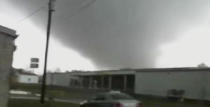 In this image made from video and released by WSB TV in Atlanta, a tornado moves through the town of Adairsville, Ga. on Wednesday, Jan 30, 2013. A fire chief says a storm that roared across northwest Georgia has left overturned vehicles on Interstate 75 northwest of Atlanta, and crews are responding to reports of people trapped in storm-damaged residential and commercial buildings. (AP Photo/WSB TV)