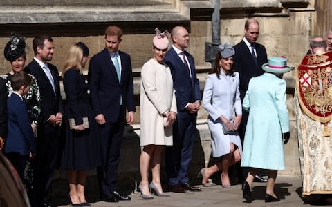 The Queen is greeted by her family at church - Credit: Adam Gray / SWNS