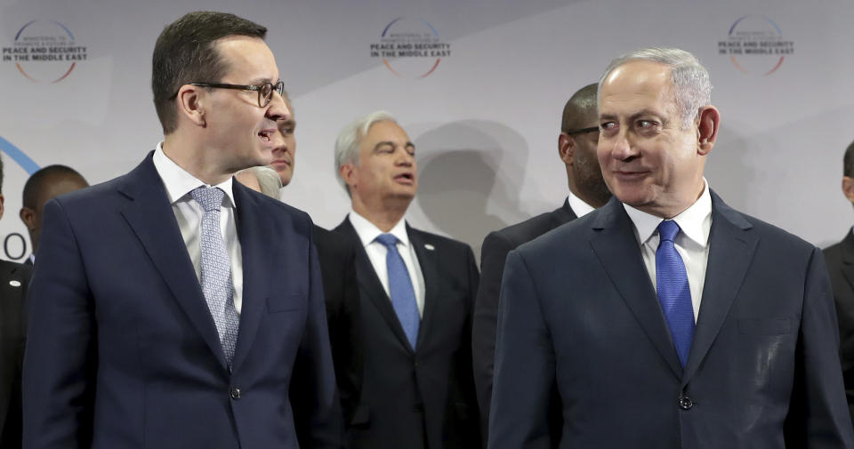 File -- In this Thursday, Feb. 14, 2019 photo Poland's Prime Minister Mateusz Morawiecki, left, and Israeli Prime Minister Benjamin Netanyahu, right, attend a group photo during a meeting in Warsaw, Poland. Poland's prime minister canceled plans for his country to send a delegation to meeting in Jerusalem on Monday after the acting Israeli foreign minister Israel Katz said that Poles "collaborated with the Nazis" and "sucked anti-Semitism from their mothers' milk". (AP Photo/Michael Sohn)