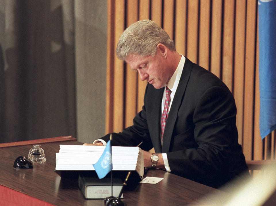 FILE - In this Tuesday, Sept. 24, 1996, file photo, President Bill Clinton signs the historic Comprehensive Nuclear Test Ban Treaty at the United Nations. Nuclear disarmament might seem like a must-discuss topic in world leaders' annual speeches at the U.N. General Assembly, which has espoused that cause since its founding. And the assembly's big annual meeting this Sept. 2021, came in a year that marked the entry into force of one nuclear weapons treaty and the anniversary of another. (AP Photo/Charles Krupa, File)