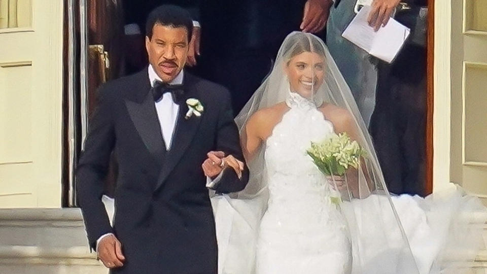 Lionel Richie walks his daughter Sofia Richie down the aisle at her wedding to Elliot Grainge over the weekend. (Photo: Backgrid)