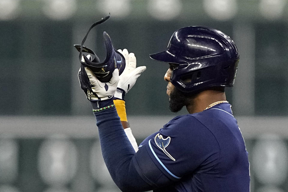 Tampa Bay Rays' Yandy Diaz celebrates after hitting a two-run double against the Houston Astros during the sixth inning of a baseball game Friday, Sept. 30, 2022, in Houston. (AP Photo/David J. Phillip)