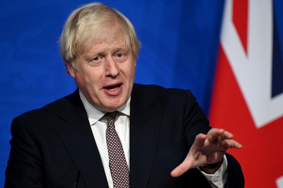 Britain's Prime Minister Boris Johnson attends a media briefing on the latest Covid-19 update in the Downing Street briefing room, central London on November 15, 2021. - Britain's booster programme for Covid-19 vaccinations is to be expanded to younger people after scientists gave the green light on Monday. The UK government's Joint Committee on Vaccination and Immunisation (JCVI) said all healthy adults aged 40-49 should be offered a booster, six months after their second dose. (Photo by Leon Neal / POOL / AFP) (Photo by LEON NEAL/POOL/AFP via Getty Images)