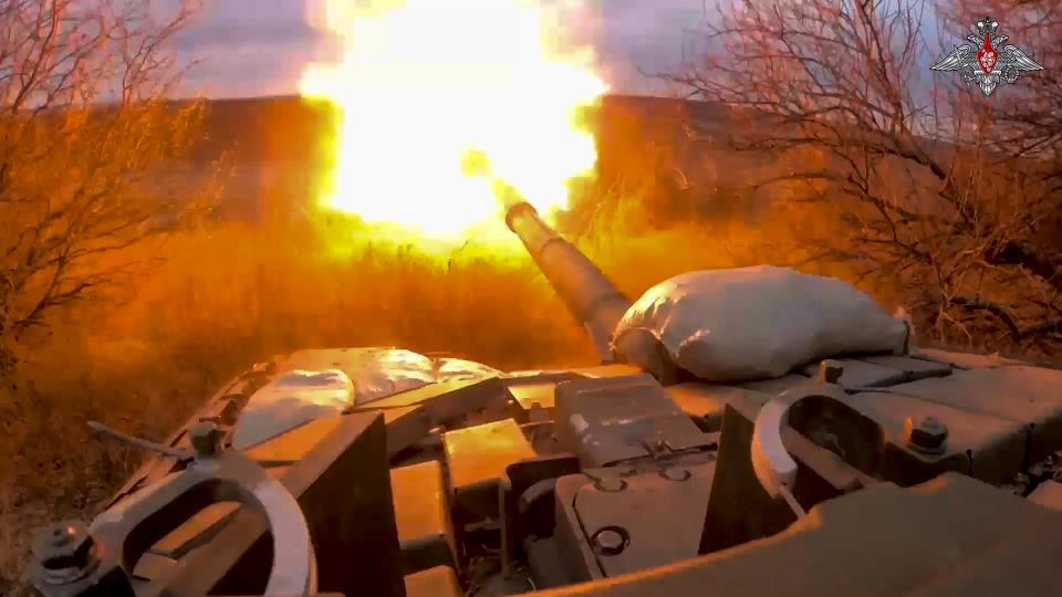 In this photo released by the Russian Defense Ministry Press Service on Tuesday, March 19, 2024, a Russian tank fires its cannon at Ukrainian troops from a position near the border with Ukraine in the Belgorod region, Russia. Ukrainian forces have launched repeated cross-border attacks on Russia's Belgorod region. (Russian Defense Ministry Press Service via AP)