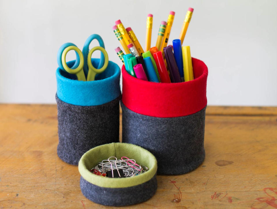 This undated image shows a felt-covered desk set of modern, color-blocked containers made from tuna fish, soup and tomato cans, in Concord, N.H. (AP Photo/Holly Ramer)