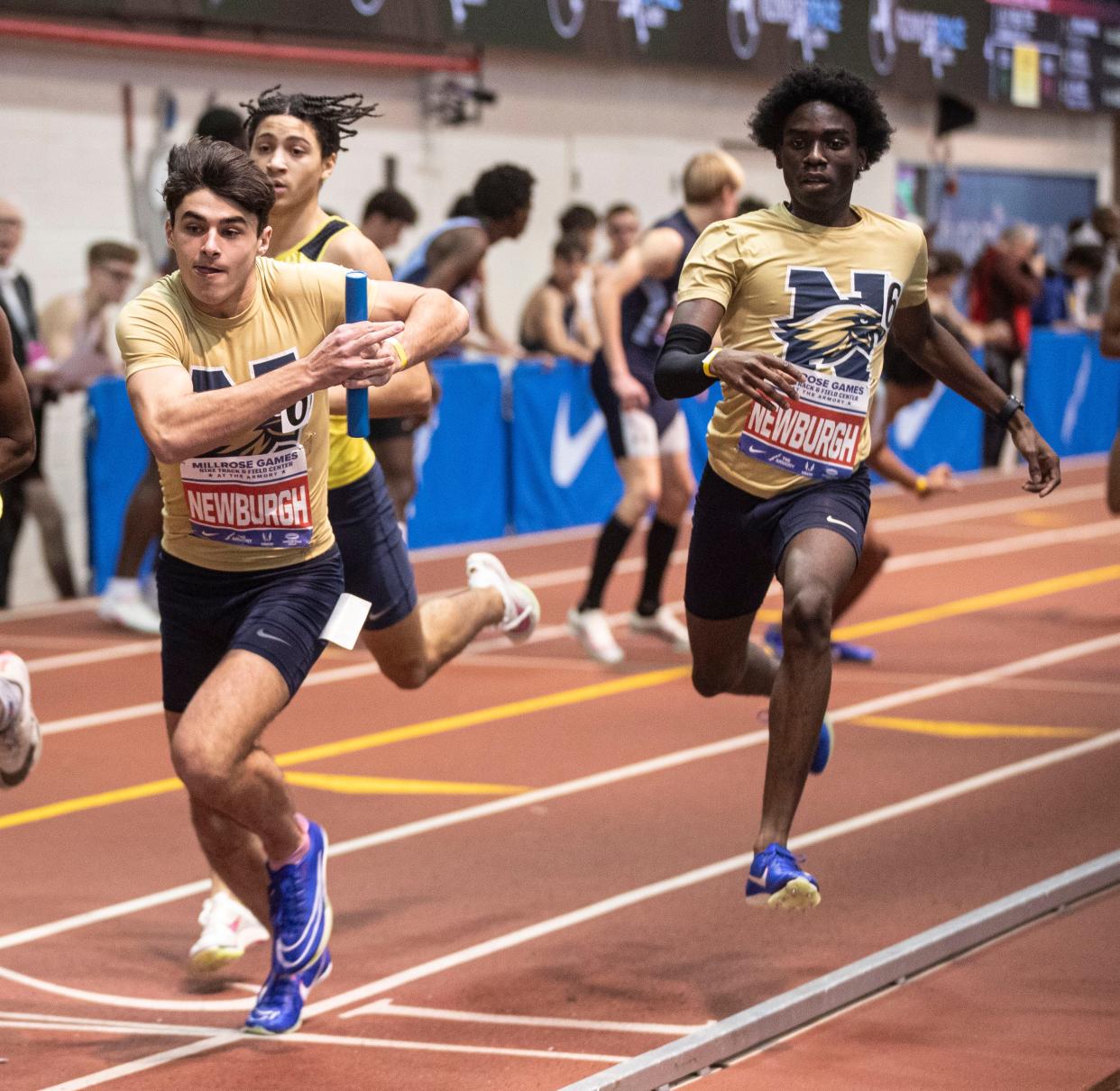 Brady Danyluk of Newburgh Free Academy runs the anchor leg after taking the baton from Anthony Burnett in the Suburban 4 x 400 meter relay during the Millrose Games at The Armory in New York City Feb. 11, 2024. Newburgh finished first with the fourth best high school time in nation this season. Mandatory Credit: Seth Harrison-Westchester County Journal News