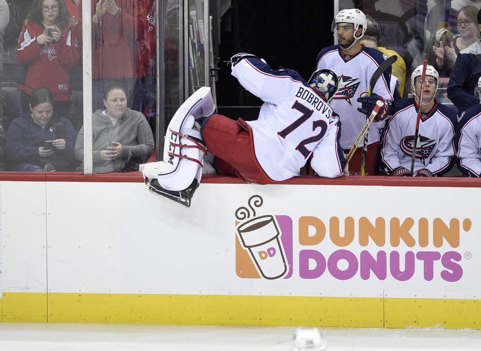 Columbus Blue Jackets goalie Sergei Bobrovsky (72), of Russia, climbs over the boards to the bench after he was pulled during the third period of an NHL hockey game against the Columbus Blue Jackets, Thursday, Jan. 5, 2017, in Washington. (AP Photo/Nick Wass)