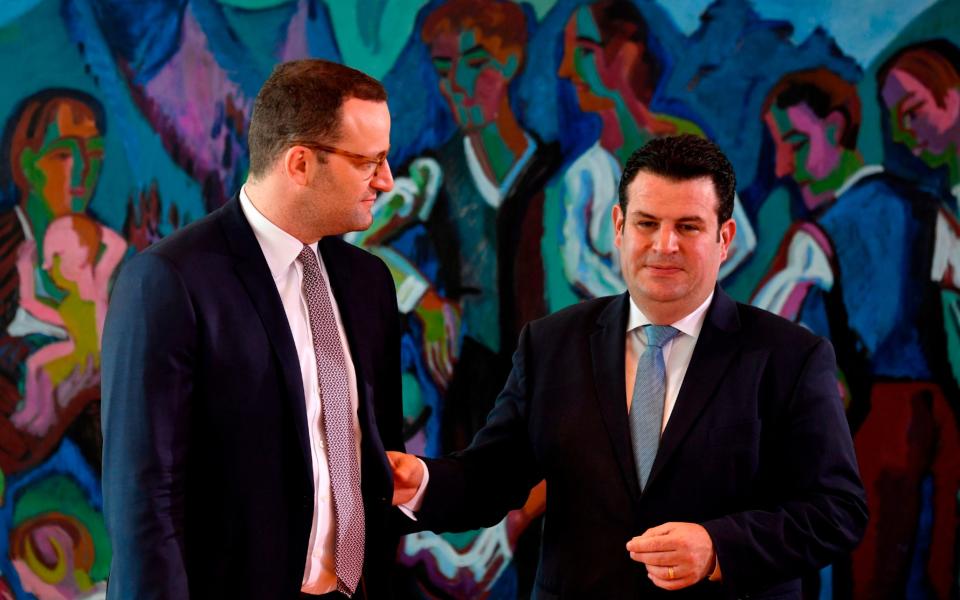 German Health Minister Jens Spahn (L) and German Labour Minister Hubertus Heil arrive for the weekly cabinet meeting in Berlin on June 27, 2018. / AFP PHOTO / John MACDOUGALLJOHN MACDOUGALL/AFP/Getty Images - JOHN MACDOUGALL/AFP