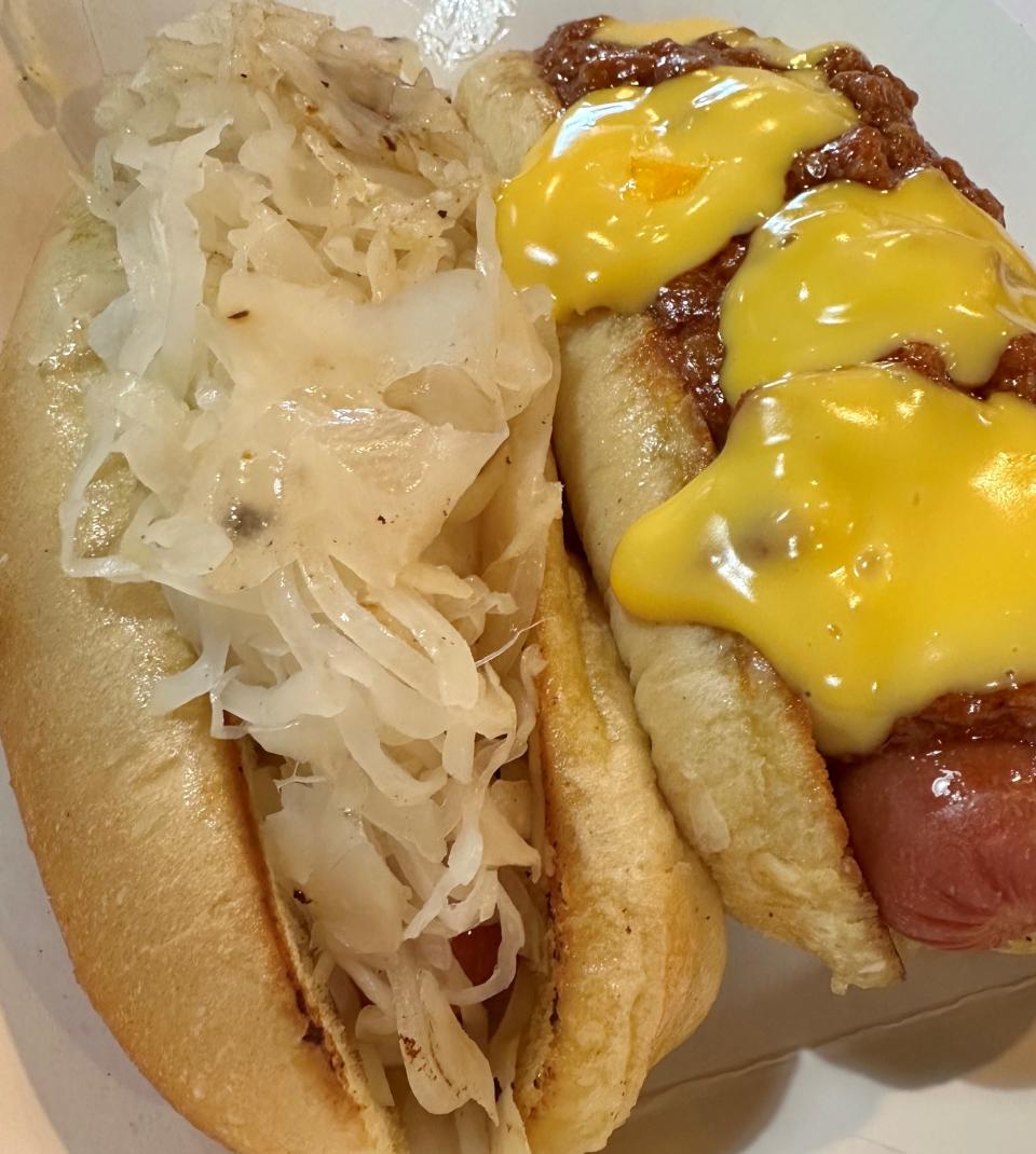 A sauerkraut hotdog with mustard and a PDQ coney dog with cheese were my messy and delicious hotdog duo at Cool Cat's Counter.