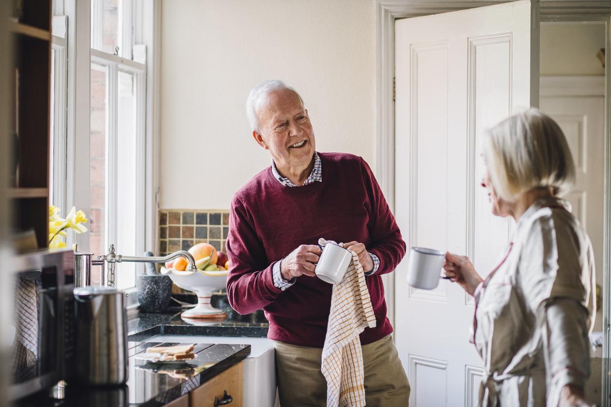 happy senior couple in kitchen