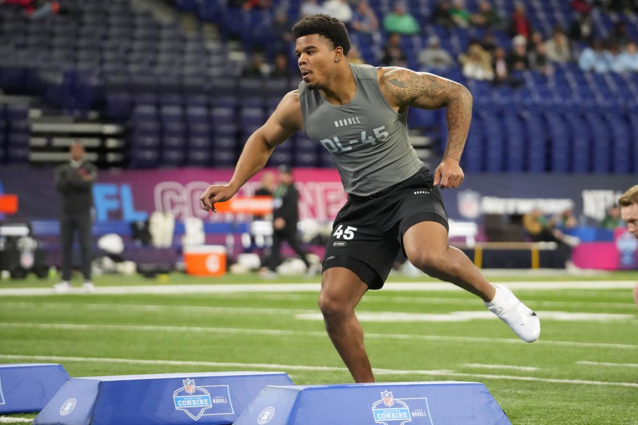 Feb 29, 2024; Indianapolis, IN, USA; Penn State defensive lineman Chop Robinson (DL45) works out during the 2024 NFL Combine at Lucas Oil Stadium. Mandatory Credit: Kirby Lee-USA TODAY Sports