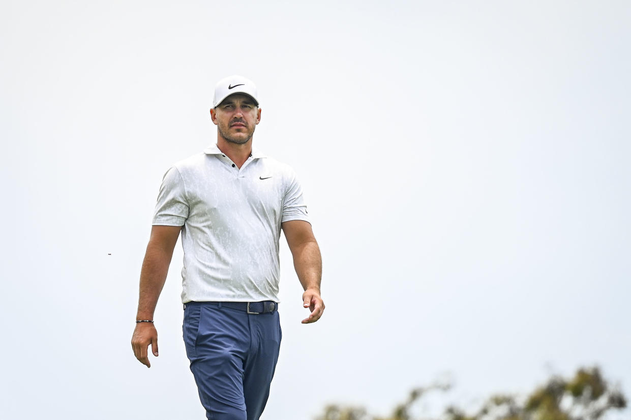 Brooks Koepka walks to the second hole tee during the first round of the 121st U.S. Open