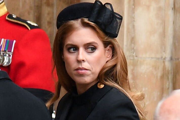 Britain's Princess Beatrice of York (C) arrives to take their seats inside Westminster Abbey in London on September 19, 2022, for the State Funeral Service for Britain's Queen Elizabeth II. - Leaders from around the world will attend the state funeral of Queen Elizabeth II. The country's longest-serving monarch, who died aged 96 after 70 years on the throne, will be honoured with a state funeral on Monday morning at Westminster Abbey. (Photo by Oli SCARFF / AFP) (Photo by OLI SCARFF/AFP via Getty Images)