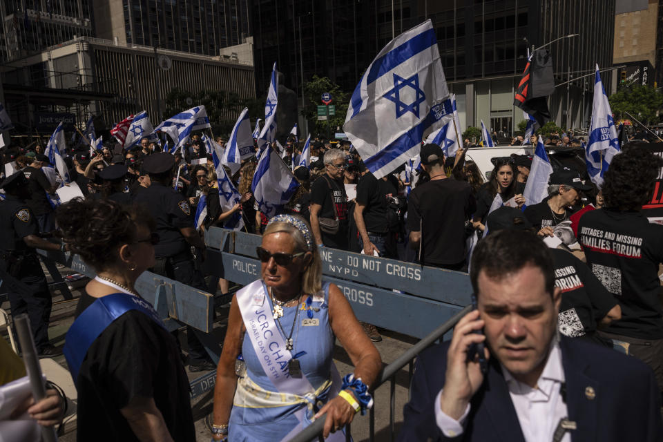 People holding Israeli flags gather ahead of the annual Israel Day Parade on Sunday, June 2, 2024, in New York. (AP Photo/Yuki Iwamura)